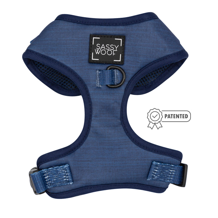 The Sassy Woof Dog Four Piece Bundle - Twilight includes a blue adjustable harness with navy trim, Sassy Woof logo patch, metal D-ring at the center, and a Patented badge icon on the right.