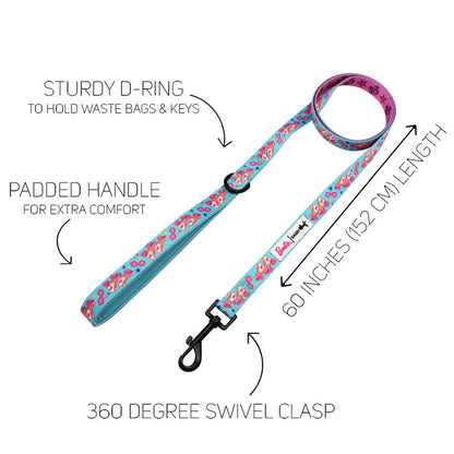 The Sassy Woof Dog Two Piece Bundle - BARBIE™ On a Roll features a padded handle, sturdy D-ring for keys or bags, and a 360° swivel clasp. The 60-inch leash is shown on a white background with arrows highlighting each feature.