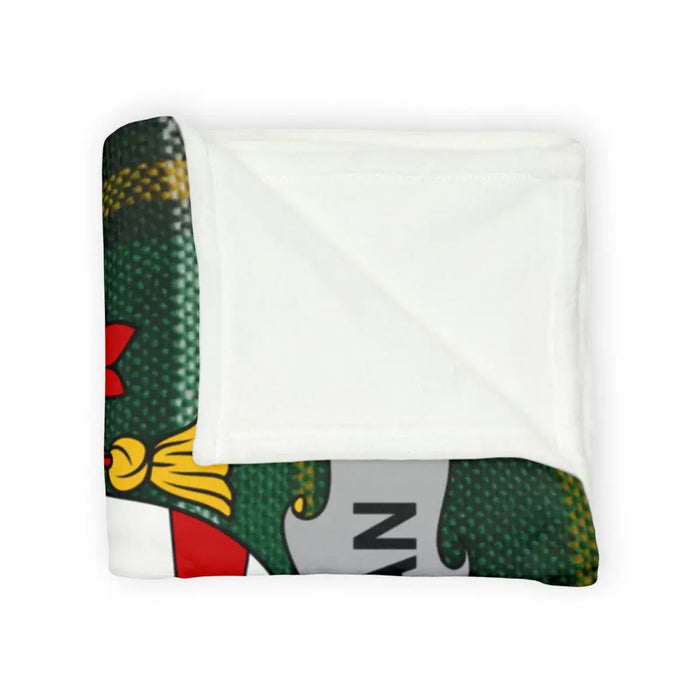 Cozy Donovan family crest throw blanket in a Christmas-themed setting