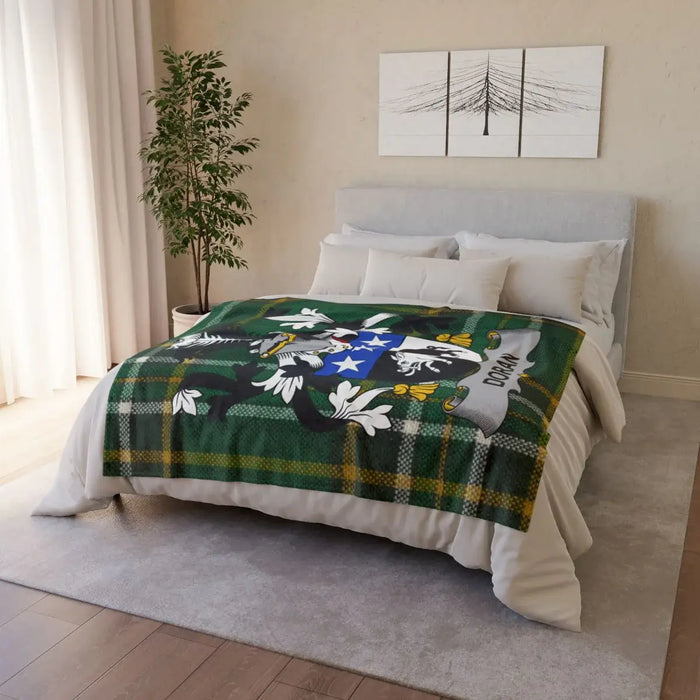 Cozy heritage green and plaid coat of arms blanket