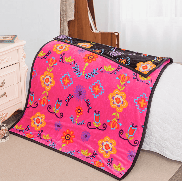 Floral Mink Baby Blanket in vibrant pink with floral patterns, perfect for snuggling and naps.