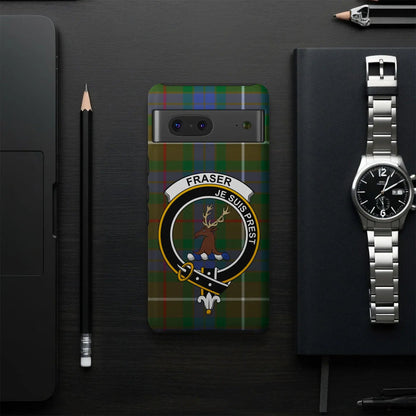 Fraser clan crest phone case on desk — red tartan design, glossy finish, full edge print