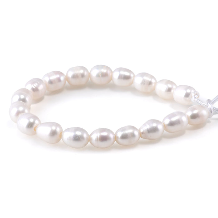This is a Dakota Stones 10mm Freshwater Pearl White Rice 2mm Gemstone strand of round beads in 8 inch strand.