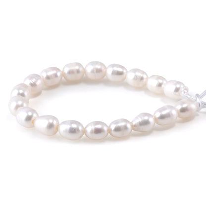 This is a Dakota Stones 10mm Freshwater Pearl White Rice 2mm Gemstone strand of round beads in 8 inch strand.