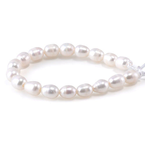 This is a Dakota Stones 10mm Freshwater Pearl White Rice 2mm Gemstone strand of round beads in 8 inch strand.