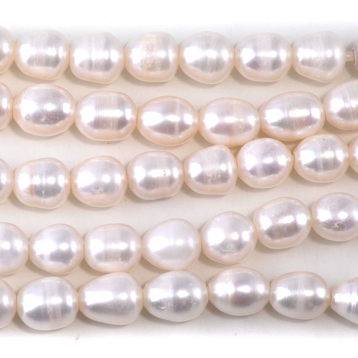 This is a Dakota Stones 10mm Freshwater Pearl White Rice 2mm Gemstone strand of round beads in 8 inch strand.