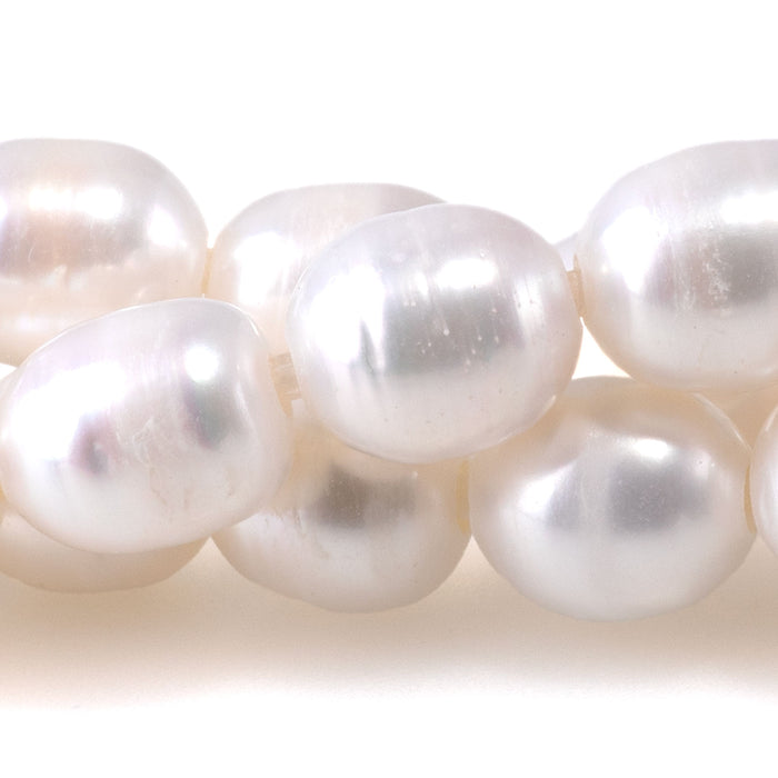 This is a Dakota Stones 10mm Freshwater Pearl White Rice 2mm Gemstone strand of round beads in 8 inch strand.