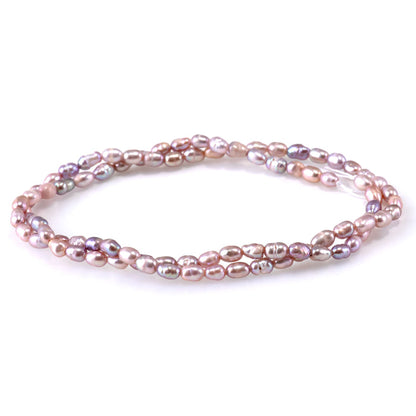 This is a Dakota Stones 3-4mm Freshwater Pearl Pink Rice Gemstone strand of round beads.