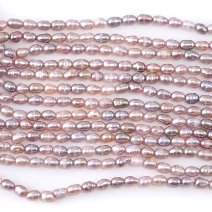 This is a Dakota Stones 3-4mm Freshwater Pearl Pink Rice Gemstone strand of round beads.