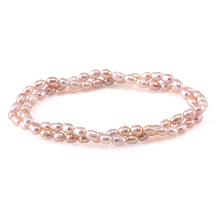 This is a Dakota Stones 4-5mm Freshwater Pearl Light Pink Rice Gemstone strand of round beads.