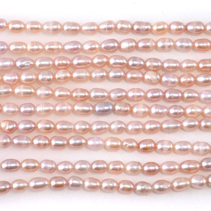 This is a Dakota Stones 4-5mm Freshwater Pearl Light Pink Rice Gemstone strand of round beads.