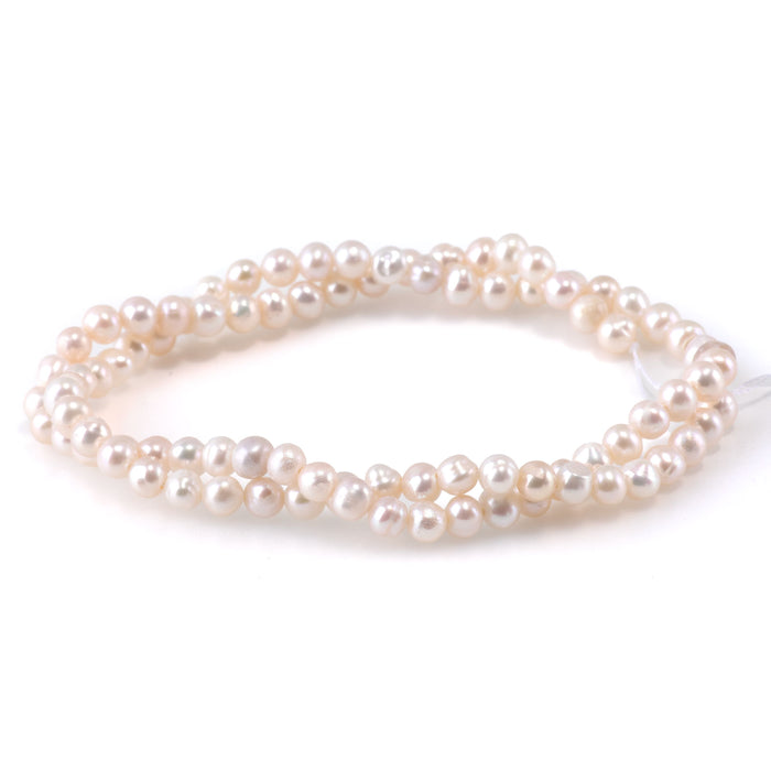 This is a Dakota Stones 4-5mm Freshwater Pearl White Potato Gemstone strand of round beads.
