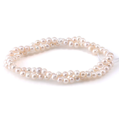 This is a Dakota Stones 4-5mm Freshwater Pearl White Potato Gemstone strand of round beads.