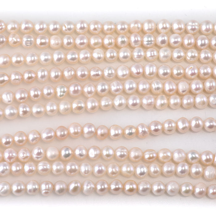 This is a Dakota Stones 4-5mm Freshwater Pearl White Potato Gemstone strand of round beads.