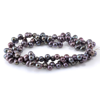 This is a Dakota Stones 5mm Freshwater Pearl Peacock Rice Gemstone strand of round beads.