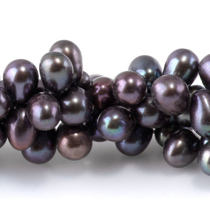 This is a Dakota Stones 5mm Freshwater Pearl Peacock Rice Gemstone strand of round beads.