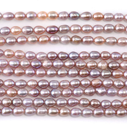 This is a Dakota Stones 5mm Freshwater Pearl Pink Rice Gemstone strand of round beads.