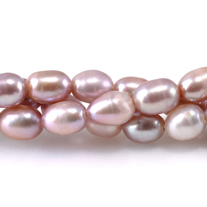 This is a Dakota Stones 5mm Freshwater Pearl Pink Rice Gemstone strand of round beads.