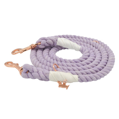 The Sassy Woof Hands-Free Rope Leash in Lavender features rose gold metal clasps and reinforced sections wrapped with white tape, and is shown coiled on a white background.