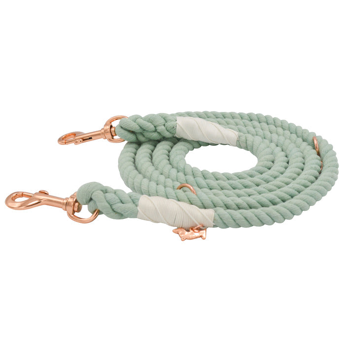 The Sassy Woof Hands-Free Rope Leash - Mint to Be is a hand-crafted mint green coiled rope leash with rose gold metal clips and white wrapped accents, displayed on a white background.