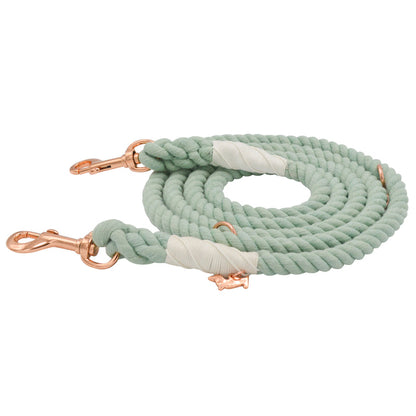 The Sassy Woof Hands-Free Rope Leash - Mint to Be is a hand-crafted mint green coiled rope leash with rose gold metal clips and white wrapped accents, displayed on a white background.