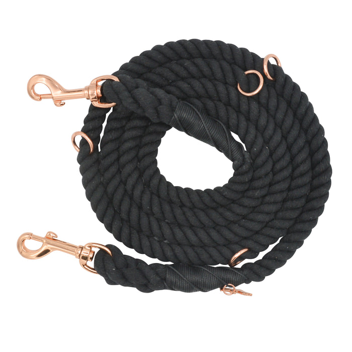 The Sassy Woof Hands-Free Rope Leash - Noir, featuring handcrafted black rope with multiple rose gold metal clips and rings, is displayed on a white background.