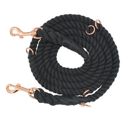 The Sassy Woof Hands-Free Rope Leash - Noir, featuring handcrafted black rope with multiple rose gold metal clips and rings, is displayed on a white background.