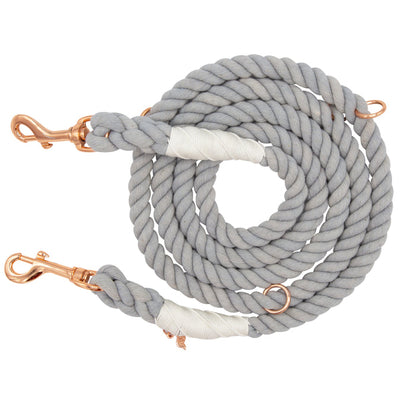 The Sassy Woof Hands-Free Rope Leash - Serenity is a coiled, light gray, hand-crafted leash featuring rose gold metal clips at both ends and white binding accents near the ends, displayed on a white background.