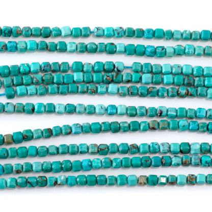 This is a Dakota Stones 3mm Hubei Turquoise Green Gemstone strand with table-cut cube beads in 15-16 inch strand.