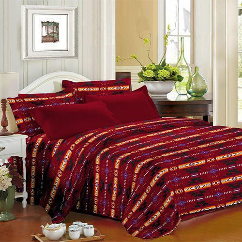 King 4pc Sheet Set – Red displayed on a bed with complimentary decor in a bright bedroom.