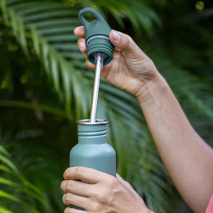 Klean Kanteen Kids Classic Water Bottle Flip Cap being removed from a bottle showing the stainless steel internal straw
