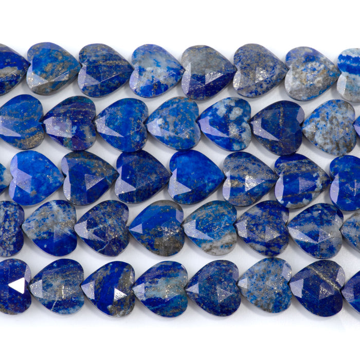 This is a Dakota Stones 14mm Lapis Gemstone strand with faceted heart beads in 15-16 inch strand.