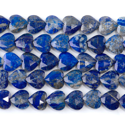 This is a Dakota Stones 14mm Lapis Gemstone strand with faceted heart beads in 15-16 inch strand.