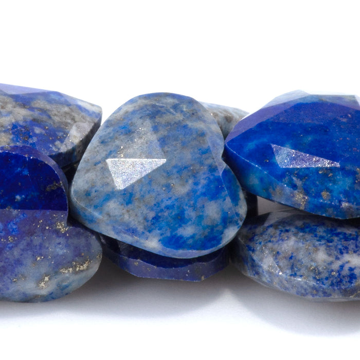 This is a Dakota Stones 14mm Lapis Gemstone strand with faceted heart beads in 15-16 inch strand.