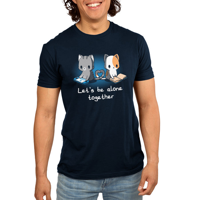 Premium Cotton T-shirt_TeeTurtle navy blue Lets Be Alone Together featuring two cartoon cats, one gray playing a handheld game and the other orange and white reading a book, sit with their tails forming a heart shape. The text reads, "Let's Be Alone Together".
