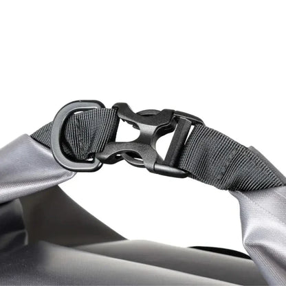 Close-up of a Lifeventure Heavy Duty Dry Bag Backpackd roll-top clip closure on a white background