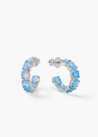 Blue opal hoops that are silver framed