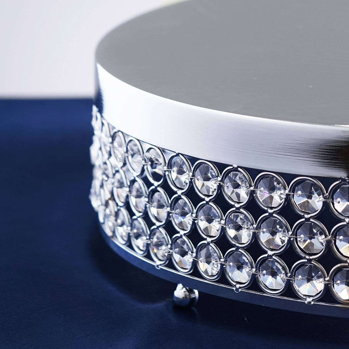 Elegant crystal embellished round display stand for showcasing products.