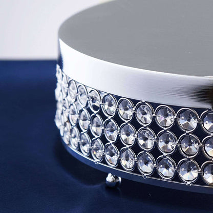 Elegant crystal embellished round display stand for showcasing products.