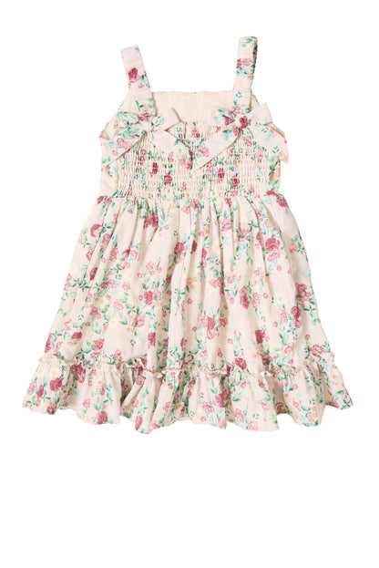 The Mini Helene Dress in Vibrant Chintz by Ivy City Co features a sleeveless design with pink and green floral chintz print, smocked bodice, ruffled hem, gathered cotton eyelet skirt, shoulder straps, and decorative chest details.