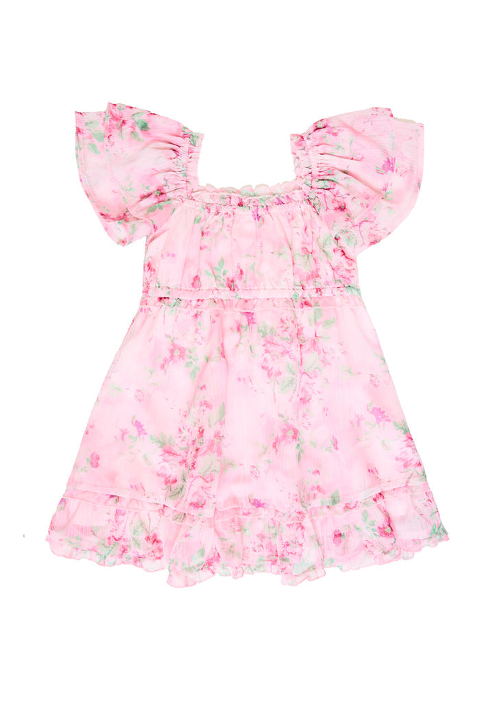 Pink floral dress against a white backdrop