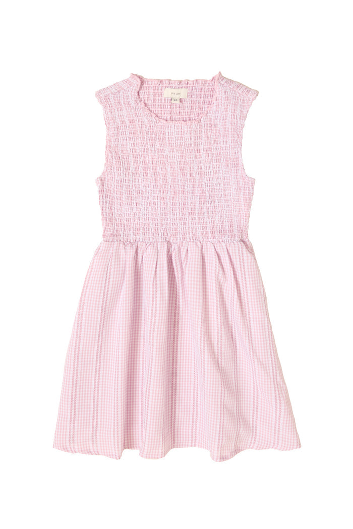 The Mini Karla Dress in Pink Striped Gingham by Ivy City Co is a sleeveless girls dress with a smocked, textured bodice, gathered flared skirt, and subtle striped gingham pattern shown on a white background.