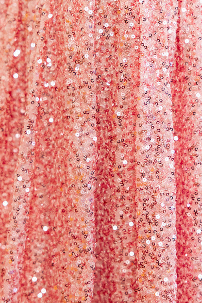 Fabric close up of pink sequin dress