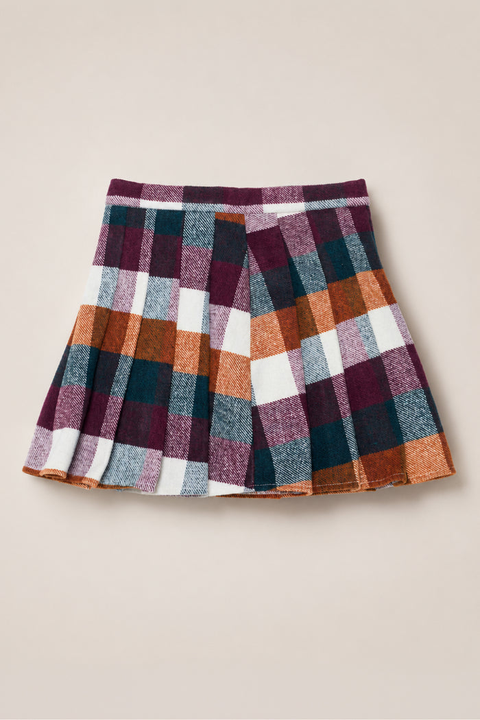 The Mini Marren Skirt in Maize Brushed Gingham by Ivy City Co, a pleated wool-blend skirt featuring a large burgundy, orange, white, teal, and gray checkered pattern, is shown laid flat on a light beige background.