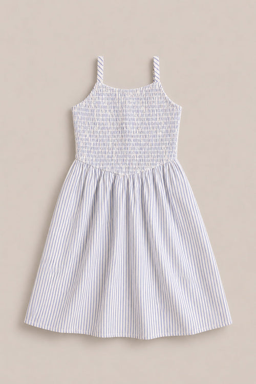 The Mini Maxwell Dress in Blue & White Pinstripe by Ivy City Co features a sleeveless design, smocked bodice, flared skirt, and thin blue stripes—ideal for stylish Mom and Me matching outfits.