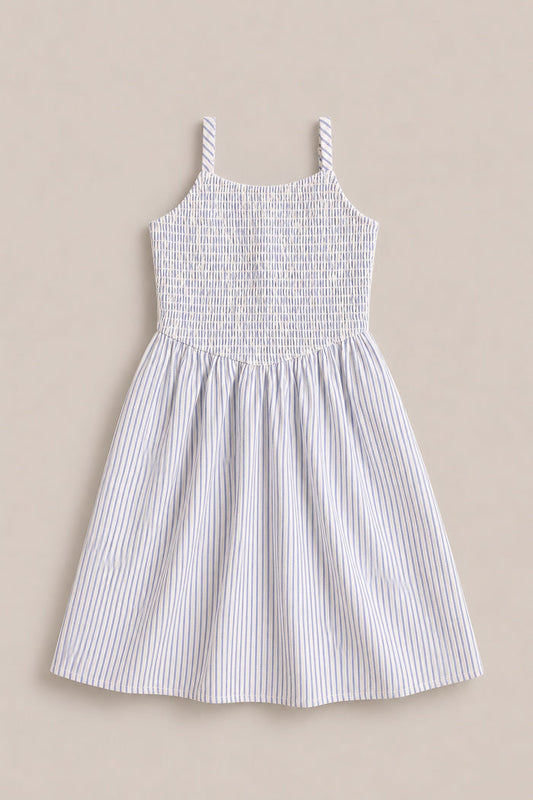 The Mini Maxwell Dress in Blue & White Pinstripe by Ivy City Co features a sleeveless design, smocked bodice, flared skirt, and thin blue stripes—ideal for stylish Mom and Me matching outfits.