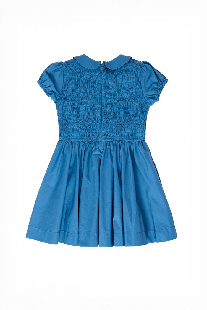 The Ivy City Co Mini Murphy Dress in Dark Teal for children features a classic Peter Pan collar, a smocked bodice with delicate floral embroidery, and a gathered skirt, shown laid flat on a white background.