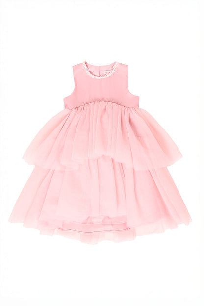 Pink tiered dress on a white background