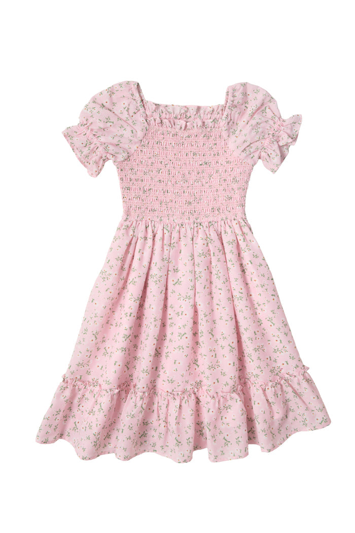 The Mini Valencia Dress in Pink Ditsy Floral by Ivy City Co features a smocked bodice, puffed sleeves, ruffled hem, and an allover pink ditsy floral print.