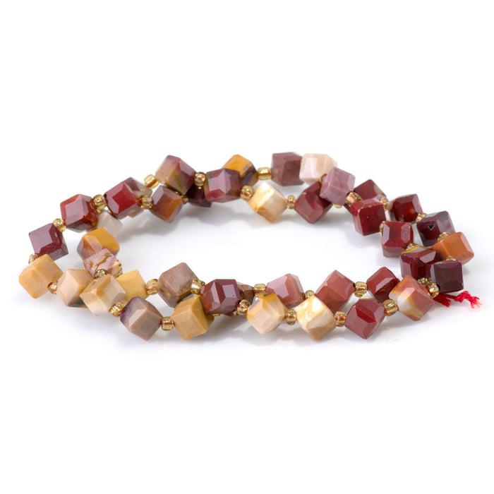 This is a Dakota Stones 6x8mm Mookaite Corner Gemstone strand with table-cut cube beads in 15-16 inch strand.